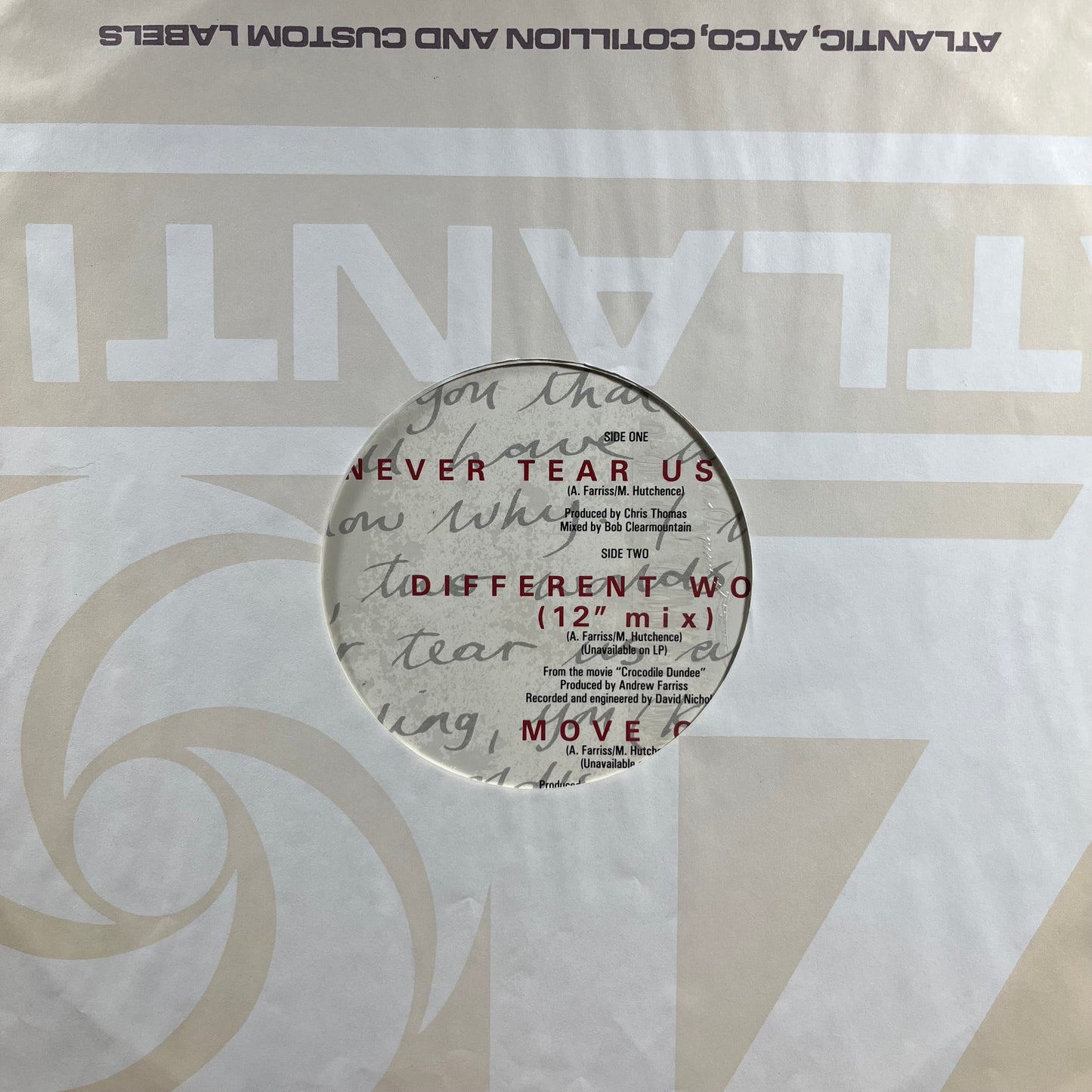 Never Tear Us Apart (VINYL) | Very Good Plus (VG+) Near Mint (NM)