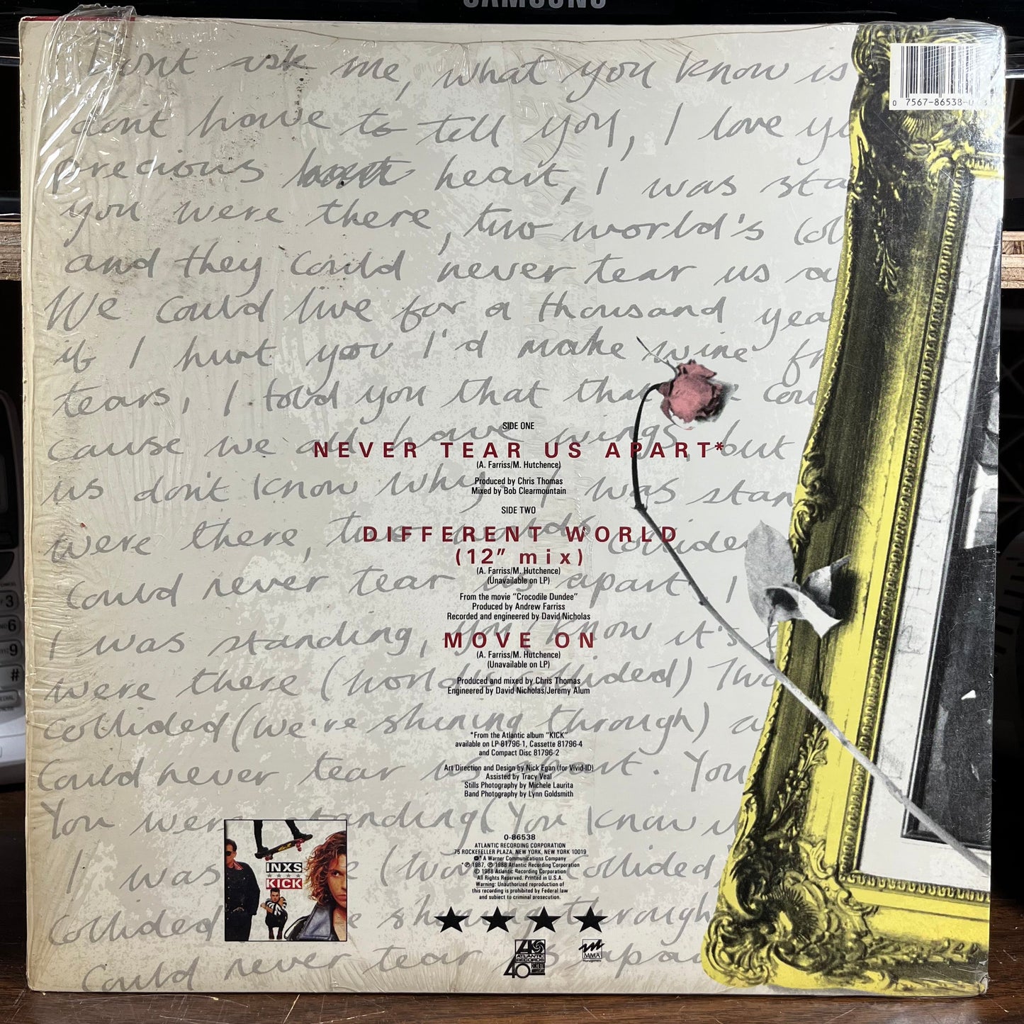 Never Tear Us Apart (VINYL) | Very Good Plus (VG+) Near Mint (NM)