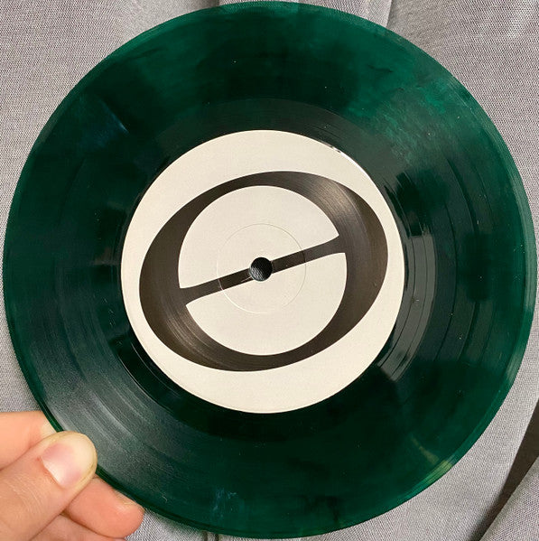 At Capacity (TRANSPARENT GREEN MARBLE VINYL 7") | Mint (M) Mint (M)